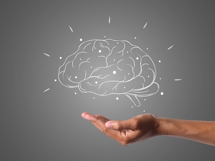 Illustration eines Gehirns, das über einer Hand schwebt